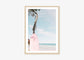 a picture of a pink surfboard on the beach